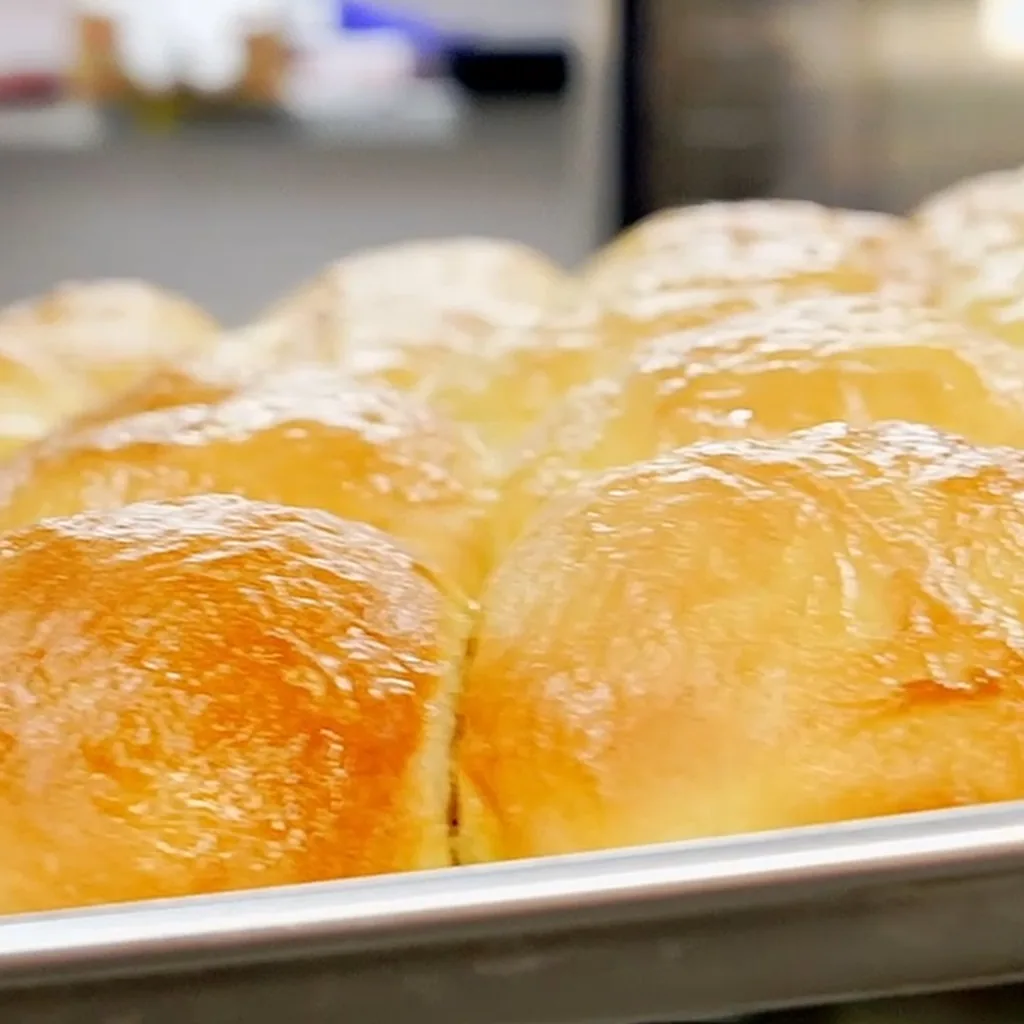Fresh bun dough proofing on a pan